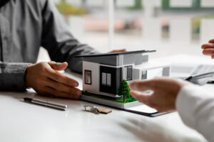 Real estate agents explain models of housing estates in projects.