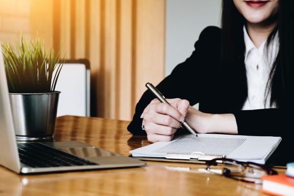 Closeup of business checking documents. Financial background, count and pay an account, copy space
