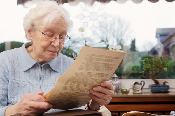 Senior women reading her old training contract
